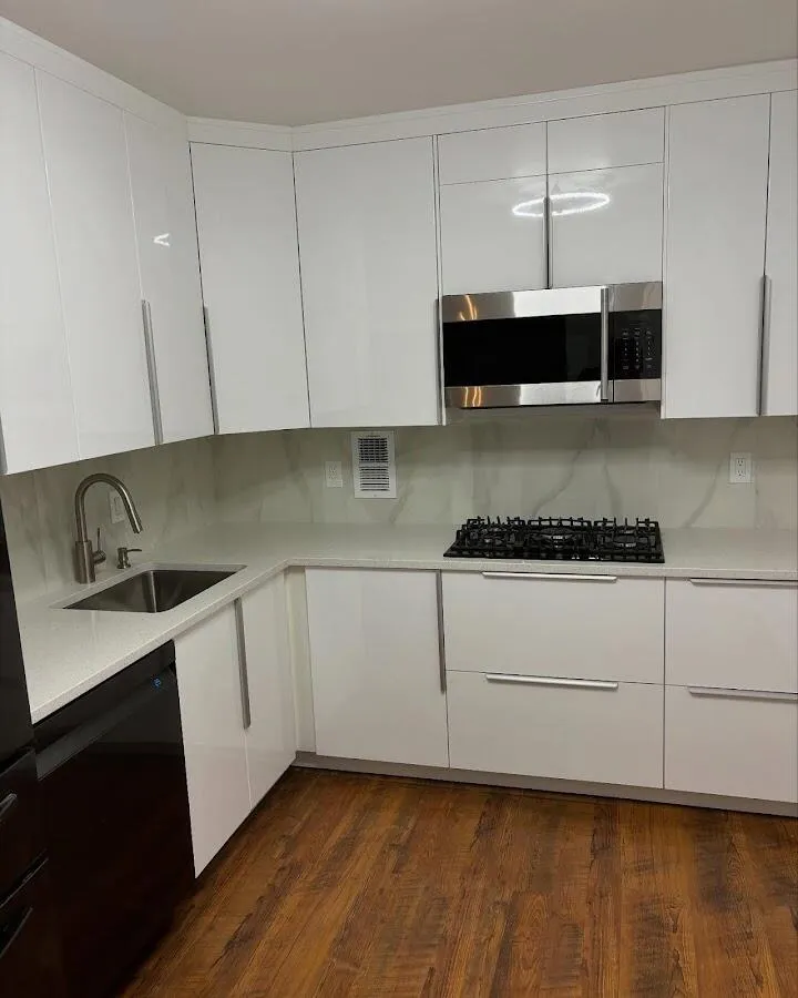 Restored kitchen with white cabinets after water damage in Bay Harbor Islands